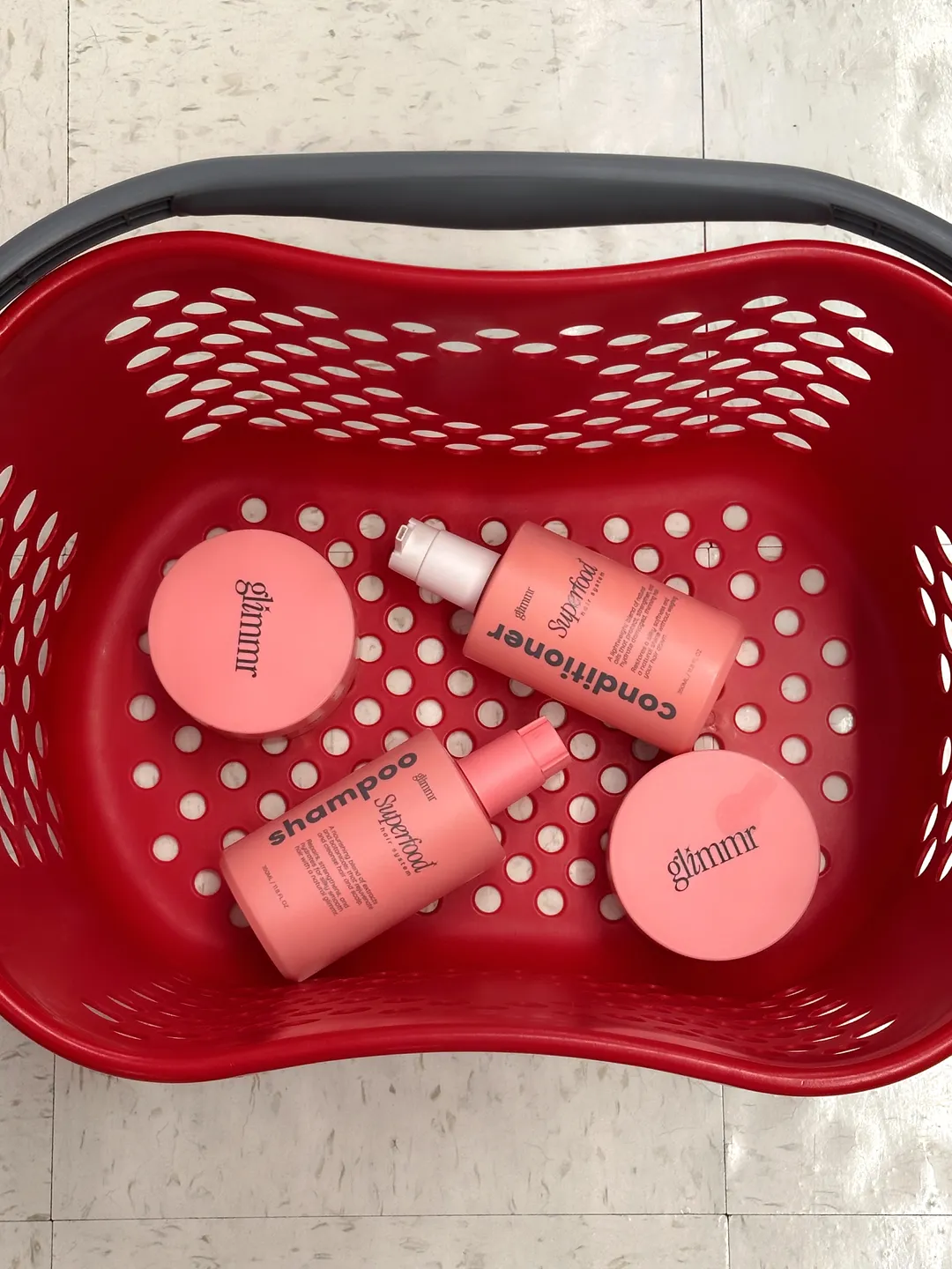 A Glimmr gift basket styled on the floor