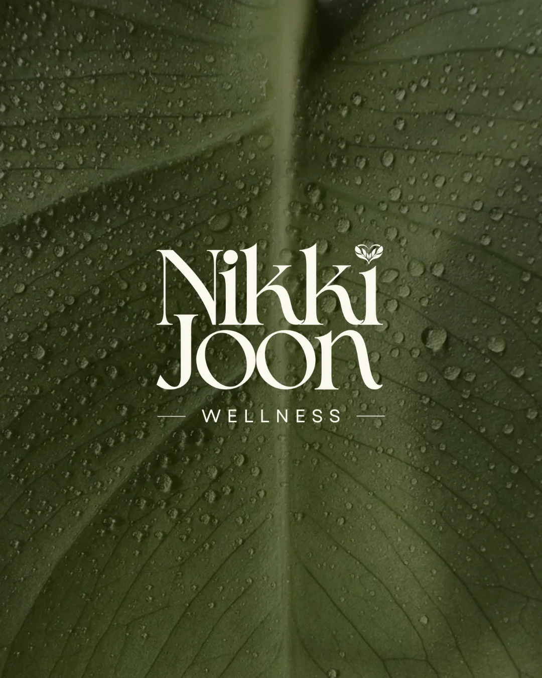 The wordmark over a rain-flecked leaf